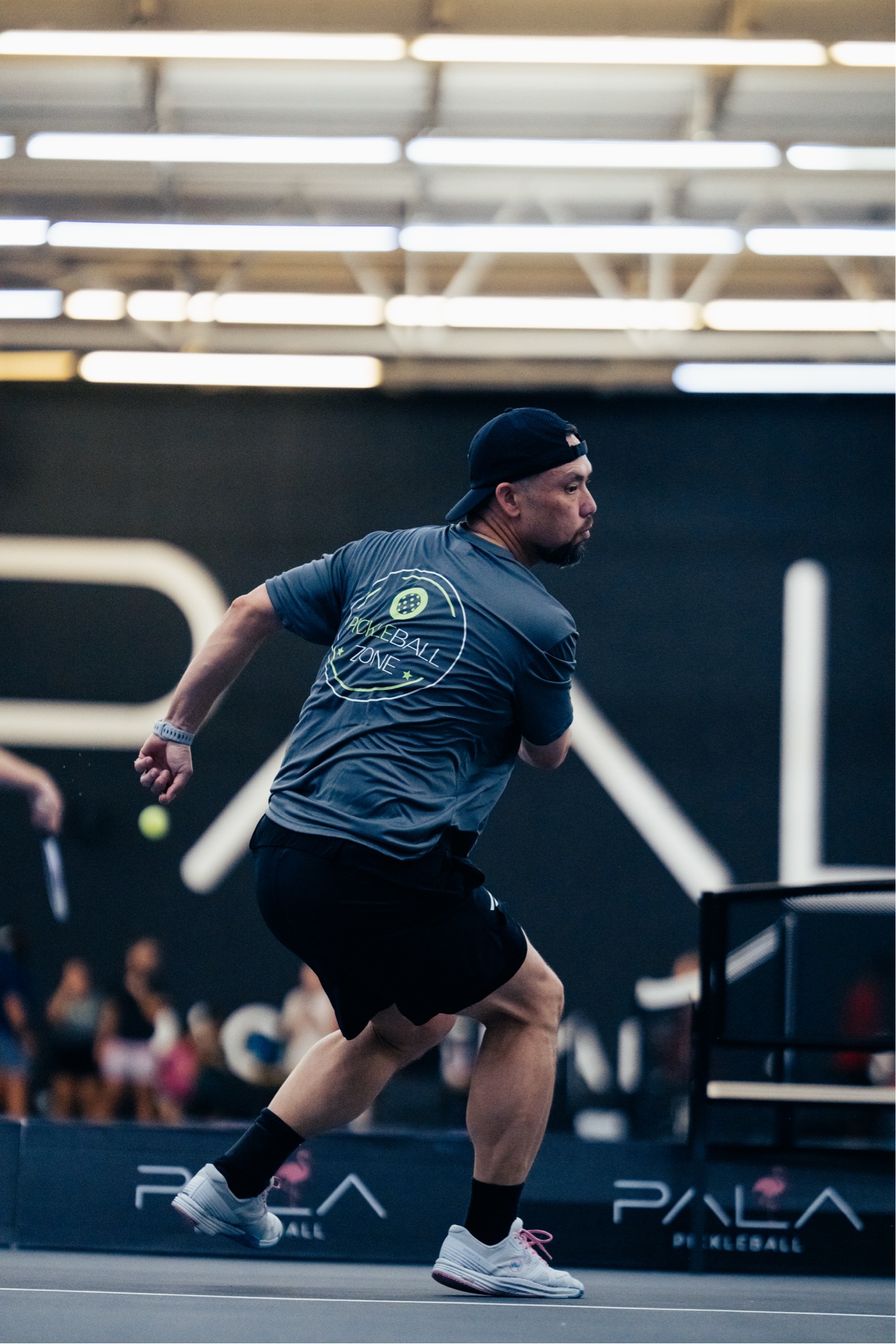 Kevin Cobb competing at tournament with Pala Pickleball backdrop