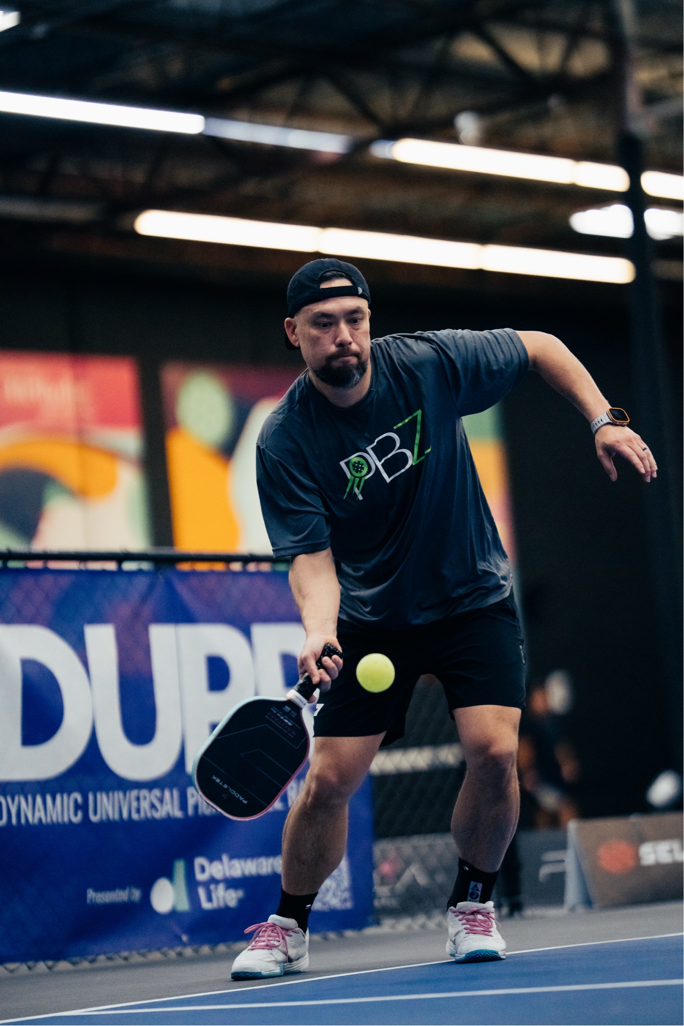 Kevin Cobb mid-volley at DUPR tournament